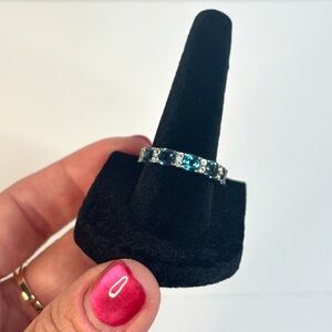 Sterling silver half eternity band with London blue and white topaz stones